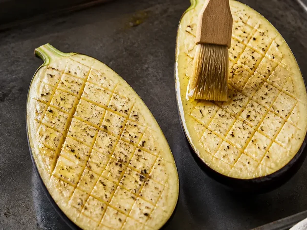 Score and season the aubergines